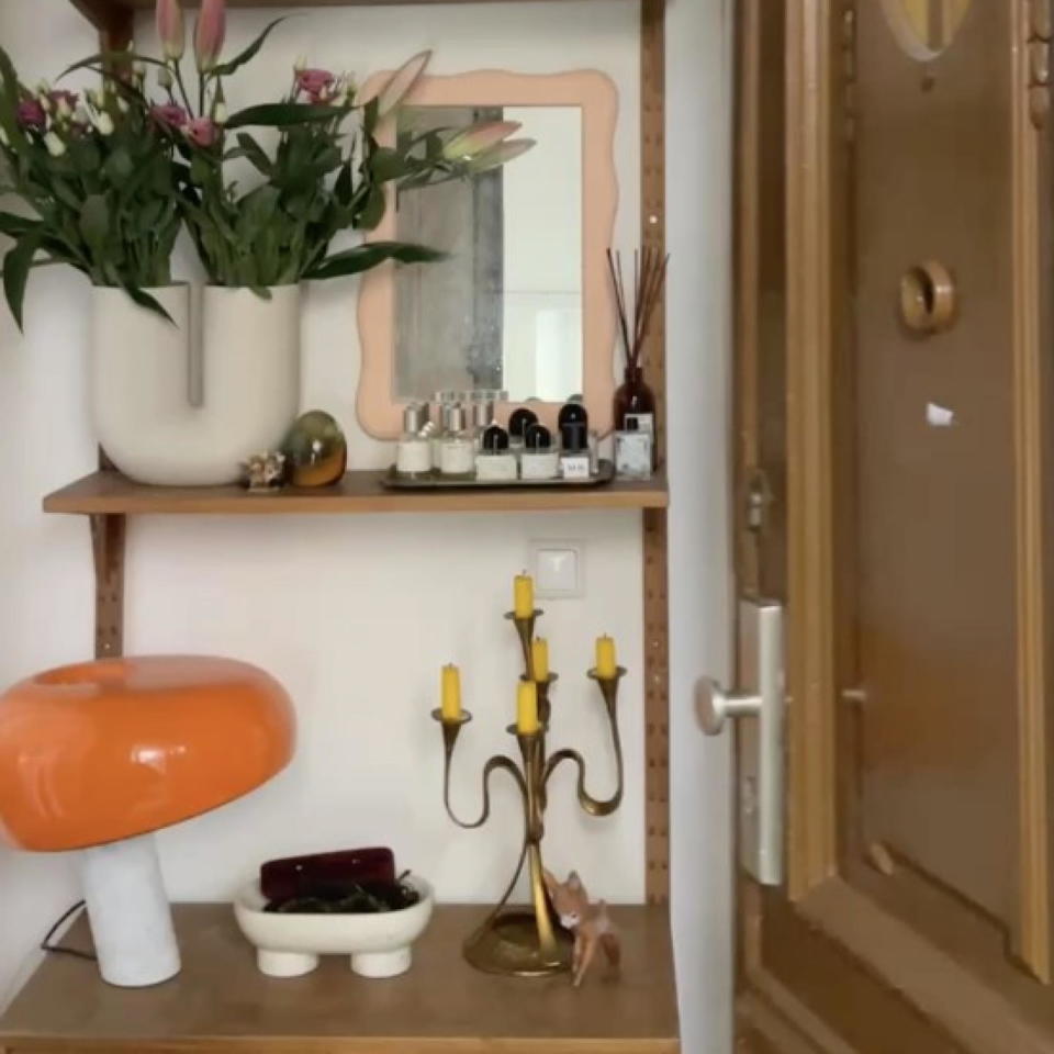 hallway shelves with mirror and lamp