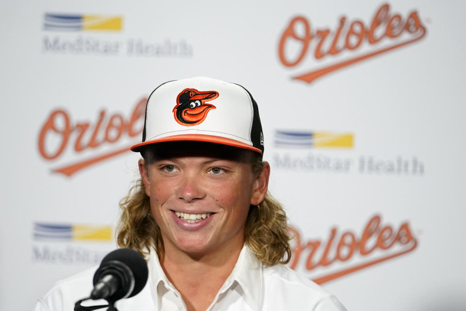 CORRECTS DATE - Jackson Holliday, the first overall draft pick by the Baltimore Orioles in the 2022 draft, speaks during a news conference introducing him to the Baltimore media prior to a baseball game between the Baltimore Orioles and the Tampa Bay Rays, Wednesday, July 27, 2022, in Baltimore. (AP Photo/Julio Cortez)