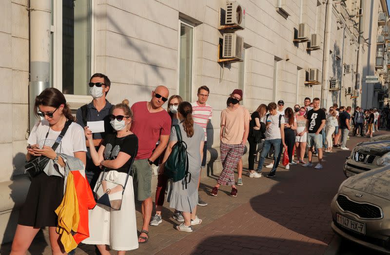 People queue to visit a souvenir and gift shop in Minsk