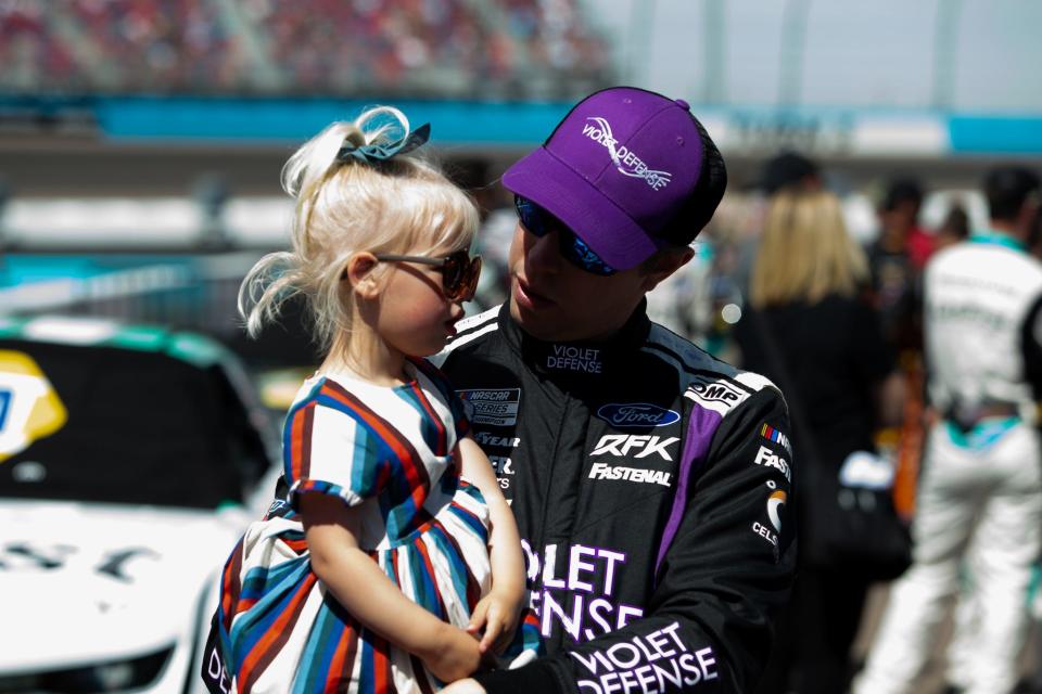 Keselowski holds his daughter on pit lane before the spring race at Phoenix in March of last year.