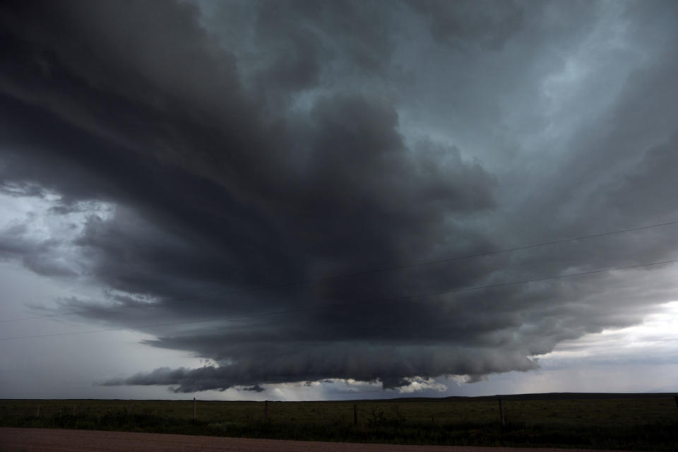 <p>Storm clouds approach members of self-described patriot groups and militias during III% United Patriots’ Field Training Exercise outside Fountain, Colo., July 29, 2017. (Photo: Jim Urquhart/Reuters) </p>