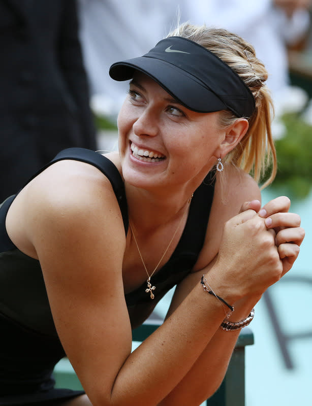 Russia's Maria Sharapova reacts after winning over Italy's Sara Errani during their Women's Singles final tennis match of the French Open tennis tournament at the Roland Garros stadium, on June 9, 2012 in Paris. AFP PHOTO / PATRICK KOVARIKPATRICK KOVARIK/AFP/GettyImages