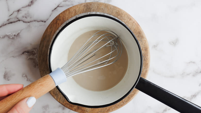 Whisking milk to froth