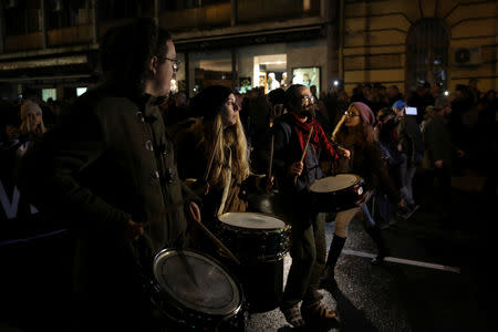 Demonstrators walk along a street during an anti-government protest in central Belgrade, Serbia, December 8, 2018. Thousands rallied peacefully in downtown Belgrade on Saturday to protest the beating of an opposition politician, policies of President Aleksandar Vucic and his ruling Serbian Progressive party. REUTERS/Marko Djurica