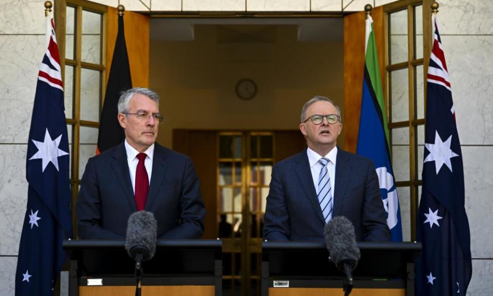 Anthony Albanese and Mark Dreyfus stand at podiums outside Parliament House giving a press conference 