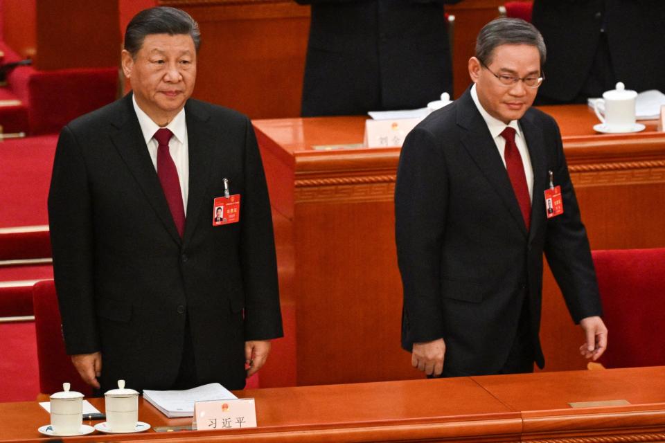 China's President Xi Jinping and Premier Li Qiang arrive for the opening session of the National People's Congress (NPC) at the Great Hall of the People in Beijing on March 5, 2024. - Copyright: Pedro Pardo/AFP/Getty Images