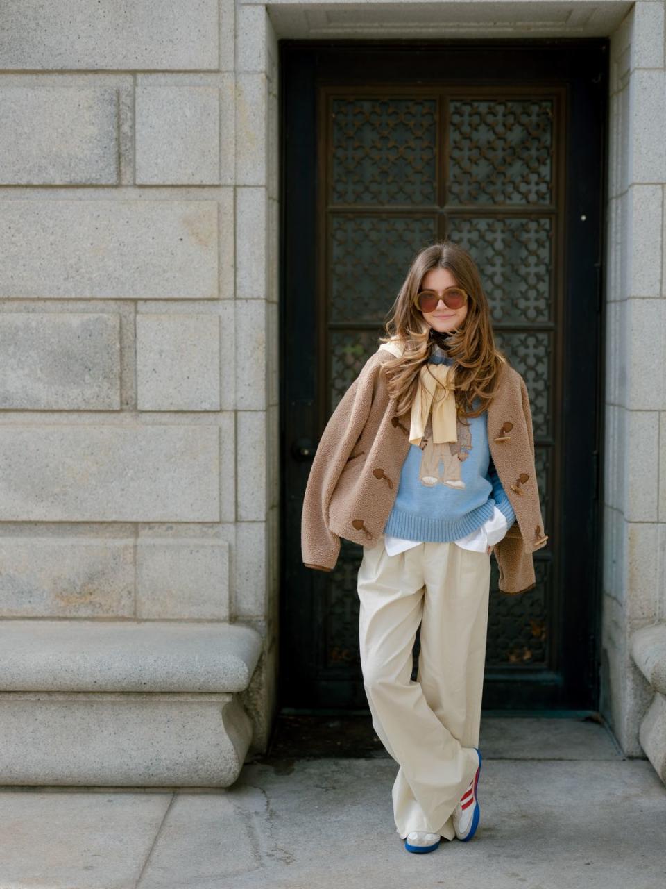 a woman standing in front of a door