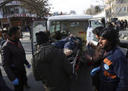 <p>An injured man is moved by a stretcher outside a hospital following a suicide attack in Kabul, Afghanistan, Saturday Jan. 27, 2018. (Photo: Rahmat Gul/AP) </p>