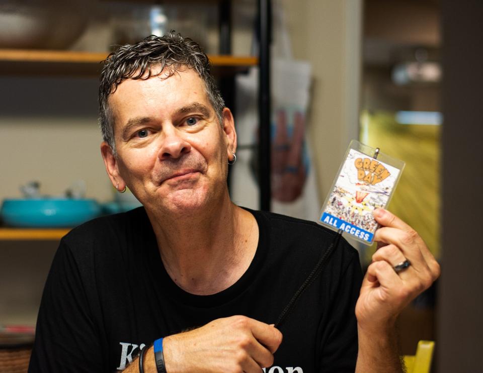 Chris Freeman of Pansy Division holds up his all-access pass for the Green Day "Dookie" tour in his living room in North Hills, Calif. on Sep. 21, 2019.