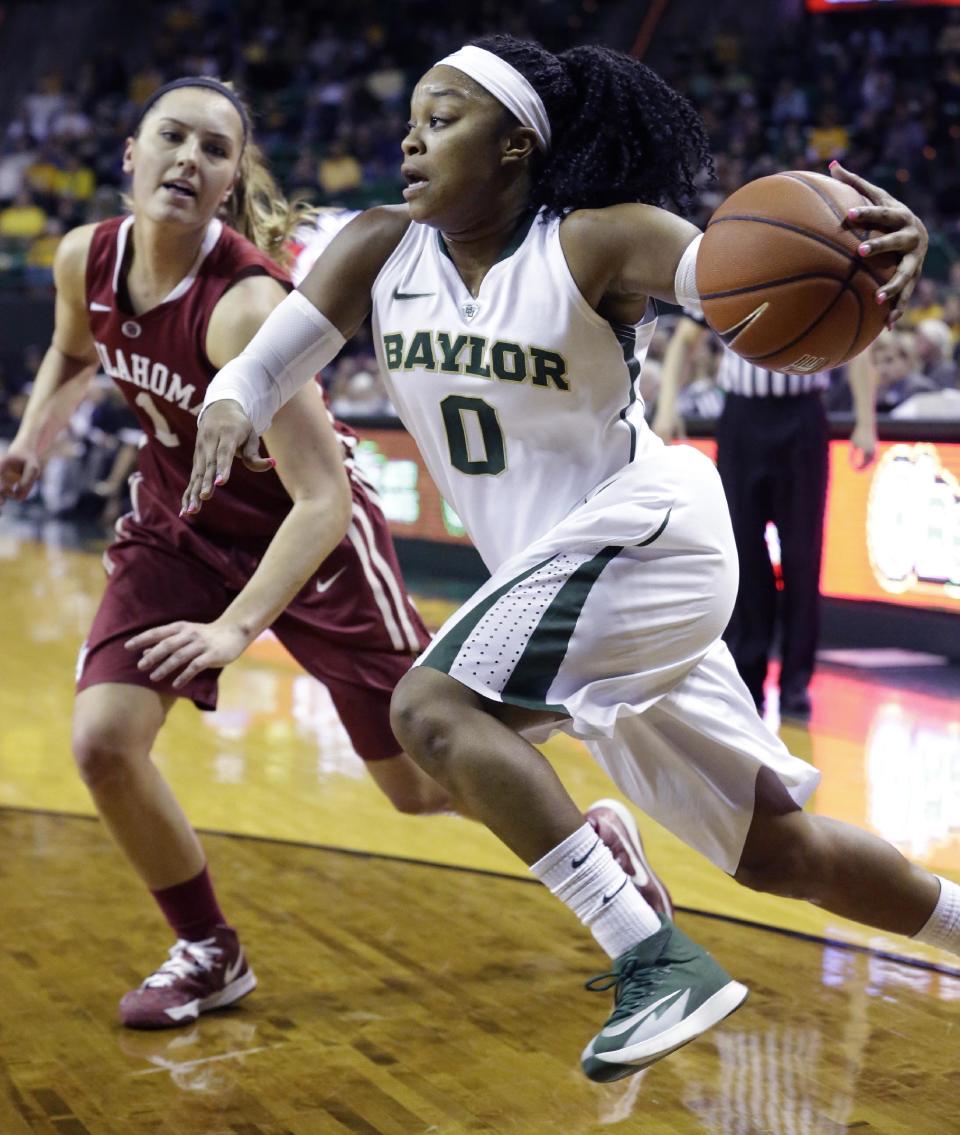 FILE - In this Feb. 21, 2014 file photo, Baylor guard Odyssey Sims (0) drives past Oklahoma guard Nicole Kornet (1) during the first half of an NCAA college basketball game in Waco, Texas. Sims was selected to The Associated Press women's basketball All-America team, released Tuesday, April 1, 2014. (AP Photo/LM Otero, File)