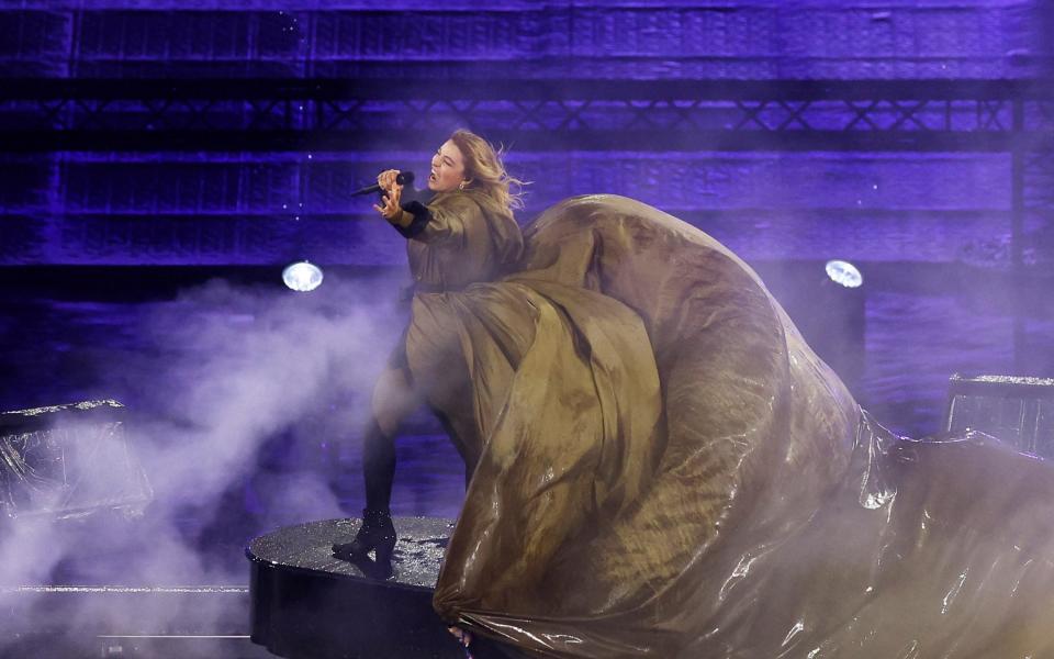 Singer Santa performs at the start of the closing ceremony