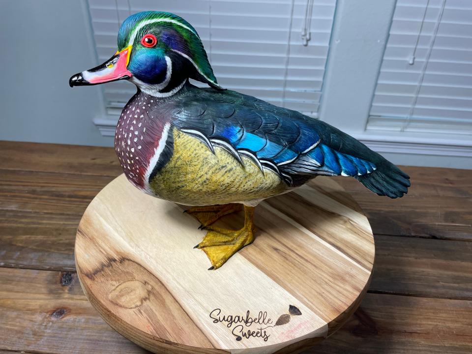 Dusty Sinclair of Corpus Christi, owner of Sugarbelle Sweets, uses taxidermy knowledge to create lifelike animal cakes using buttercream and modeling chocolate. Since 2020, Sinclair has specialized in creating realistic hunting and fishing inspired cakes for weddings and large events.