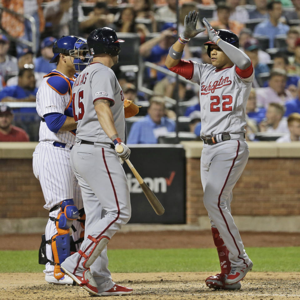 Washington Nationals' Juan Soto, right, celebrates his home run with Matt Adams during the eighth inning of a baseball game against the New York Mets, Saturday, Aug. 10, 2019, in New York. (AP Photo/Seth Wenig)