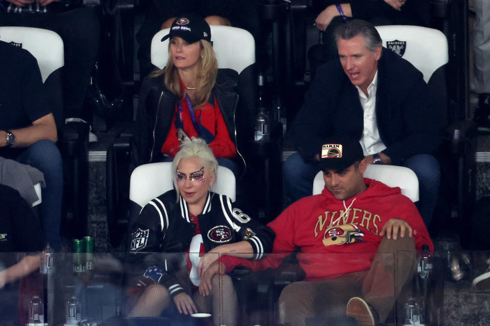 Lady Gaga and boyfriend Michael Polansky wearing 49ers gear.