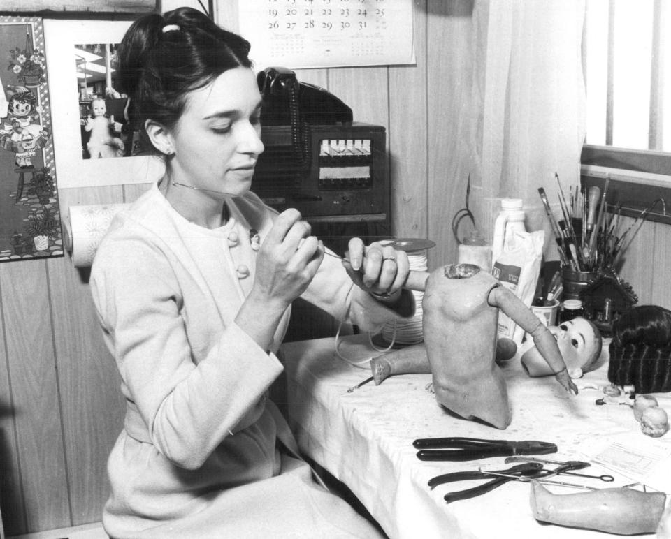 Linda Greenfield works on a doll in 1978 at the Chili Doll Hospital and Victorian Doll Museum.