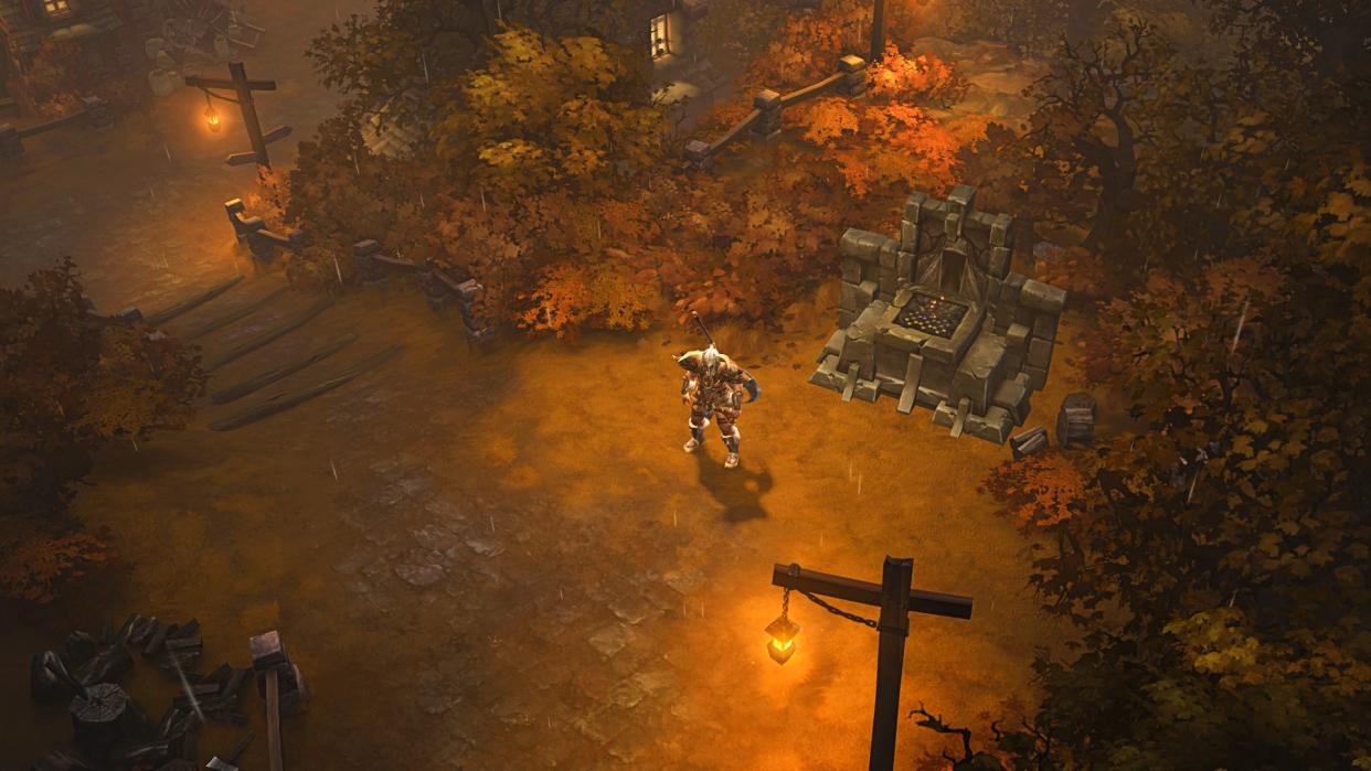  A Diablo 3 player walks to an altar in a forest. 