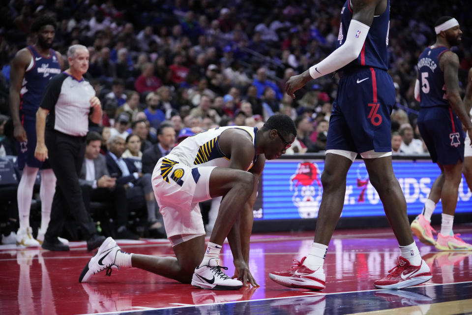 Indiana Pacers' Jalen Smith is slow to get up after an injury during the first half of an NBA basketball in-season tournament game against the Philadelphia 76ers, Tuesday, Nov. 14, 2023, in Philadelphia. (AP Photo/Matt Slocum)