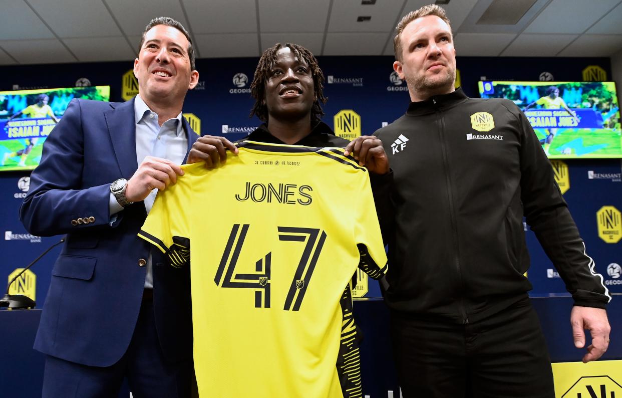 Isaiah Jones, 17, from Thompson’s Station, Nashville SC General Manager Mike Jacobs, left, and Nashville SC Academy Director Kevin Flanagan pose for a photograph during a press conference at Geodis Park Wednesday, Feb. 7, 2024, in Nashville, Tenn. Jones, a Nashville SC Academy midfielder, signed his professional contract through 2027.