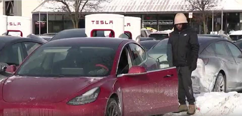 A visibly frustrated Tesla owner in a Chicago suburb