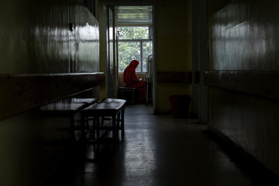 An Afghan mother sits by her child's bed at the malnutrition ward of the Indira Gandhi hospital in Kabul, Afghanistan, Sunday, May 22, 2022. Some 1.1 million Afghan children under the age of five will face malnutrition by the end of the year. , as hospitals wards are already packed with sick children . (AP Photo/Ebrahim Noroozi)