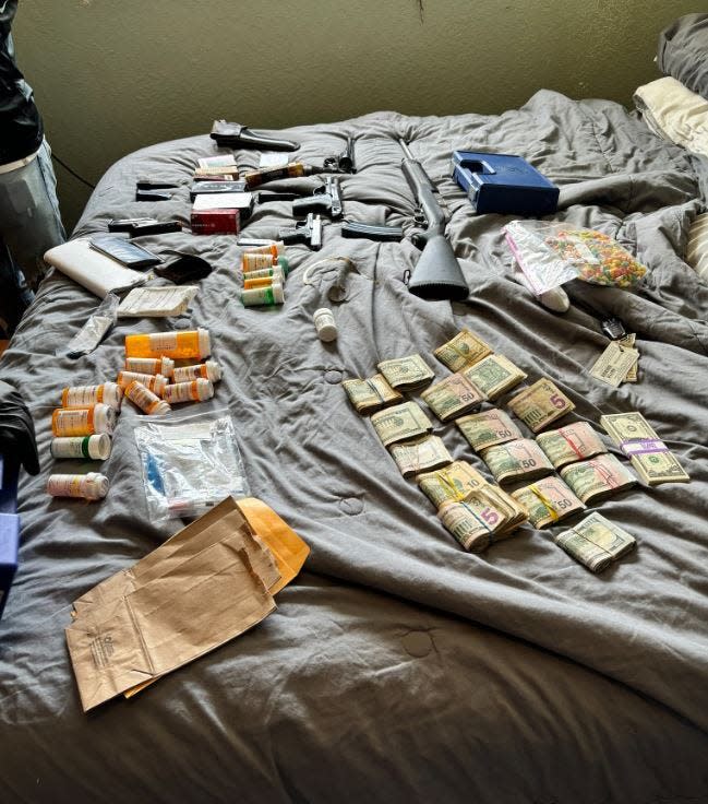 Cape Coral Police say detectives found $32,121, various pill bottles, 14 firearms with magazines and ammunition, a safe, and needles with a spoon while serving a search warrant at the home of Richard M. Riley, 57, of Cape Coral on Thursday, July 25, 2024.
