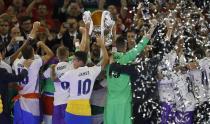 <p>Sergio Ramos of Real Madrid lifts The Champions League trophy after the UEFA Champions League Final between Juventus and Real Madrid at National Stadium of Wales on June 3, 2017 in Cardiff, Wales. </p>