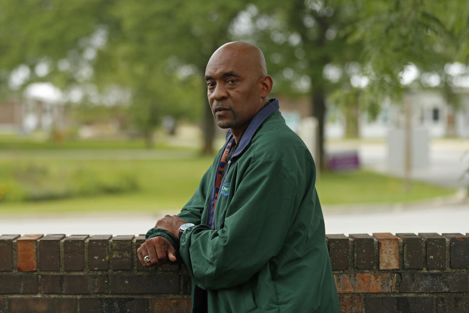 Crosby Smith, care provider at Ludeman Developmental Center, a state home for the developmentally disabled, poses for a portrait near the center premise, Thursday, July 8, 2021 in Park Forest, Ill. Smith and his fiancee were among numerous staff and residents at the Ludeman Developmental Center who contracted the virus last year. He said the hazard money helped pay down credit cards and avoid further debt when buying clothing and shoes. (AP Photo/Shafkat Anowar)