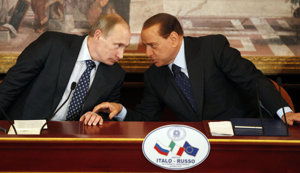 FILE - Italian former Premier Silvio Berlusconi, right, and Russian Prime Minister Vladimir Putin talk during a press conference at Villa Gernetto, in Gerno, near Milan, Italy, Monday April 26, 2010. Just in time to celebrate his 86th birthday, Italy's former premier Silvio Berlusconi is making his return to Italy's parliament, winning a seat in the Senate nearly a decade after being banned from public office over a tax fraud conviction. (AP Photo/Luca Bruno, file)