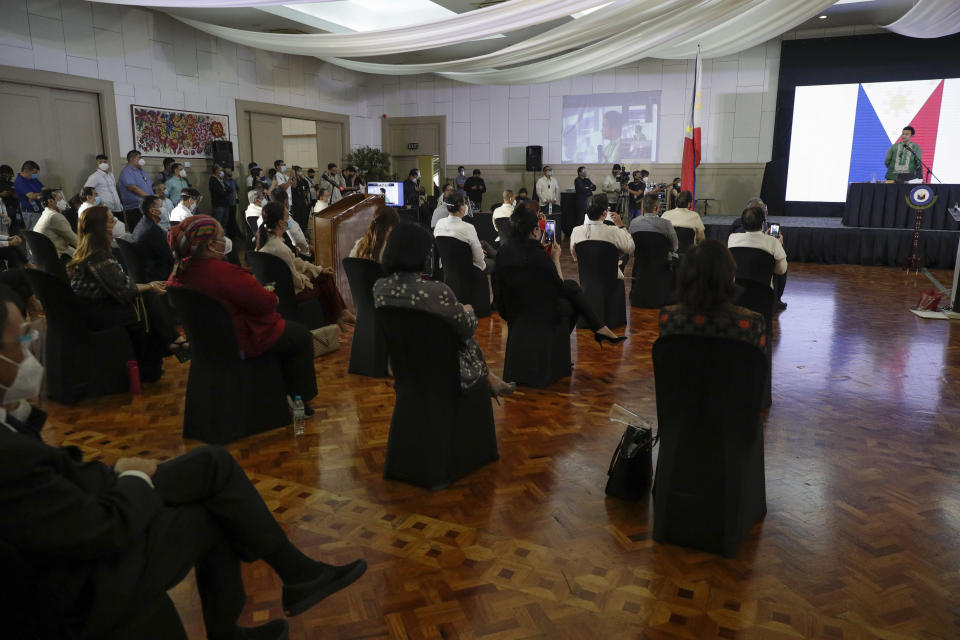 Representative Lord Allan Velasco, right, speaks after being sworn in as new house speaker by supporters at the Celebrity sports club in Quezon city, Philippines, Monday, Oct. 12, 2020. A large faction of Philippine legislators in the House of Representatives has elected a new leader but the incumbent speaker declared the vote “a travesty” in a tense political standoff between two allies of the president. (AP Photo/Aaron Favila)