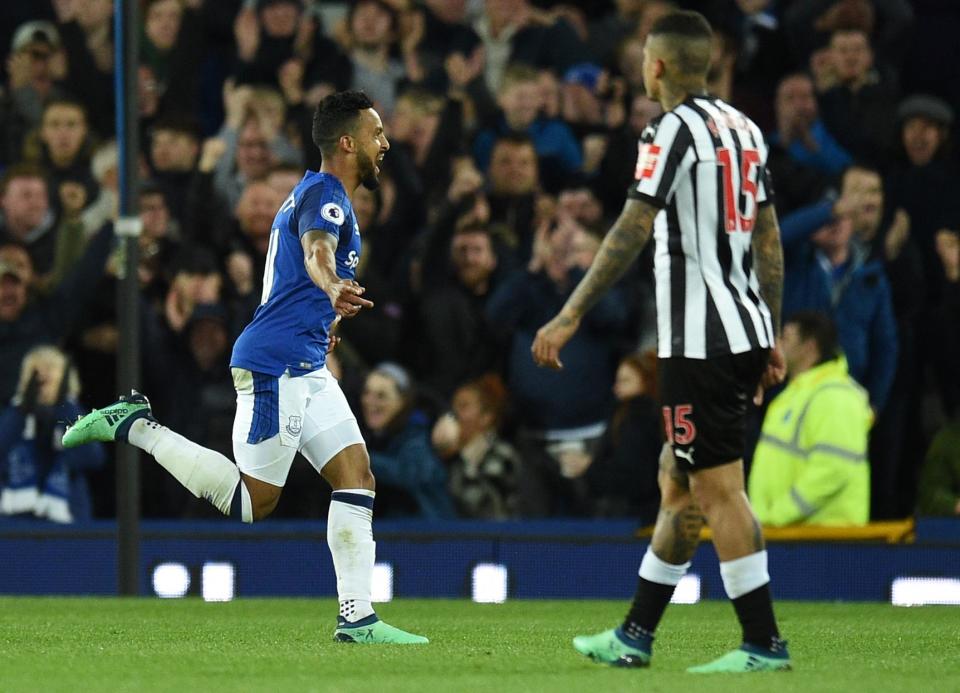 Theo Walcott celebrates hitting what proved to be the winner: Getty