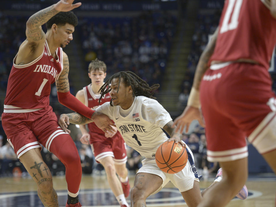 Penn State's Ace Baldwin Jr. (1) drives to the basket against Indiana's Kel'el Ware (1) during the first half of an NCAA college basketball game Saturday Feb. 24, 2024, in State College, Pa. (AP Photo/Gary M. Baranec)