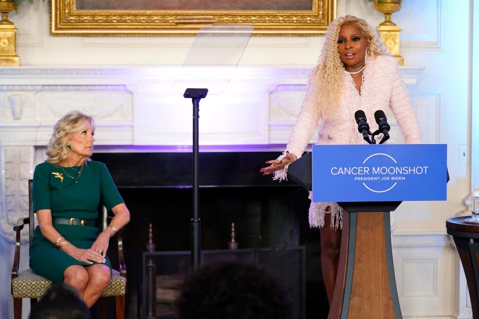 Mary J. Blige speaks alongside first lady Jill Biden during an event to launch the American Cancer Society's national roundtables on breast and cervical cancer in the State Dining Room of the White House, Oct. 24, 2022.