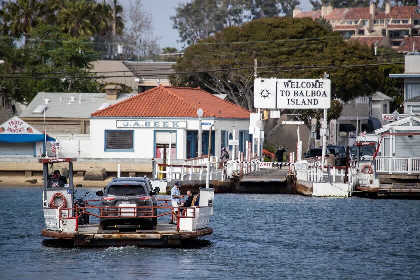 Newport Beach, CA - April 25: The Balboa Island Ferry travels to Balboa Island from the Newport Peninsula in Newport Beach Tuesday, April 25, 2023. The Balboa Island Ferry has operated in Newport Beach since 1919, but a new mandate handed down by the California Air Resources Board has placed its future, for the first time in little over a century of operation, up in the air. Short-run ferries, like the Balboa Island Ferry, are required to use zero-emission engines by the end of 2025 and the operators of the Ferry cannot afford to convert the boats. (Allen J. Schaben / Los Angeles Times)