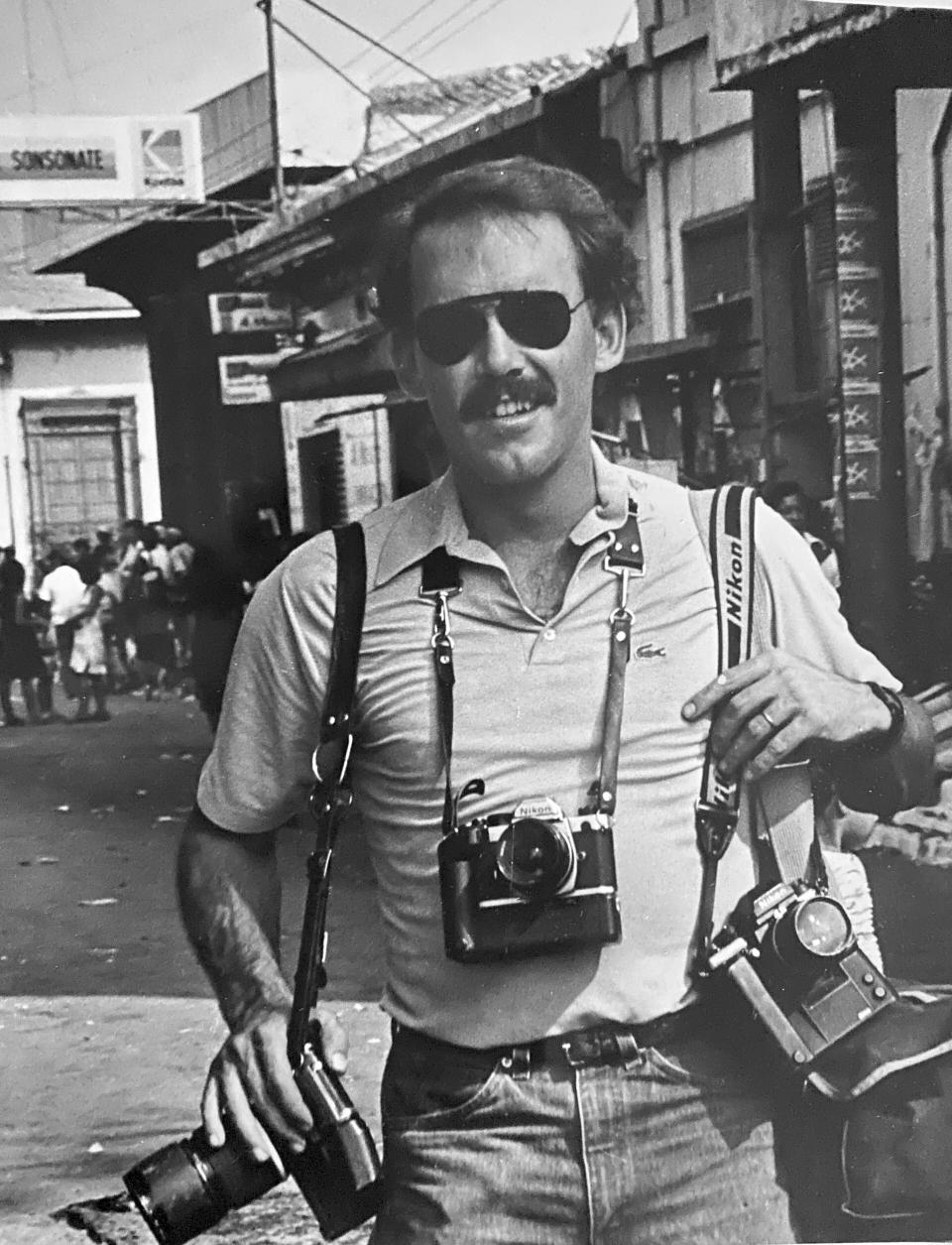 This undated family photo shows photographer Pat Hamilton in El Salvador. Hamilton, a combat veteran of the Vietnam War who covered the civil wars in Central America as a photojournalist for The Associated Press, and who later worked at Reuters covering the Gulf War in Iraq, died Sunday, Aug. 13, 2023, after a long struggle with cancer. He was 74. (Courtesy Sylvia Hamilton via AP)