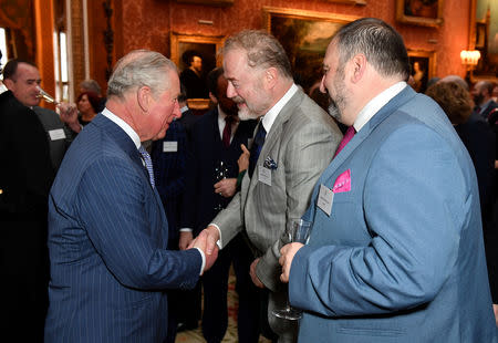 Britain's Charles, the Prince of Wales, actor Owen Teale and singer Wynne Evans at a reception to mark the fiftieth anniversary of the investiture of the Prince of Wales at Buckingham Palace in London, Britain March 5, 2019. Dominic Lipinski/Pool via REUTERS