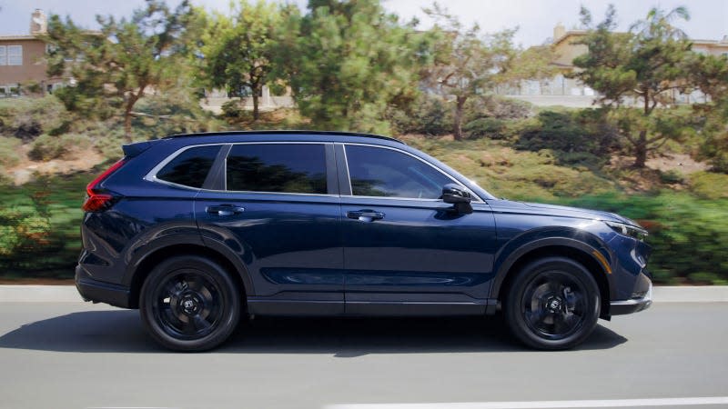 A photo of a blue Honda CR-V Hybrid taken in profile. 