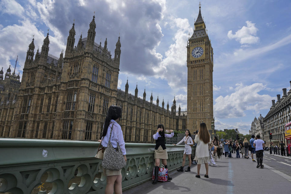 With Big Ben in the background, tourists take snapshots on Westminster Bridge in London, Thursday, July 6, 2023. Crowds are packing the Colosseum, the Louvre, the Acropolis and other major attractions as tourism exceeds 2019 records in some of Europe’s most popular destinations. While European tourists helped the industry on the road to recovery last year, the upswing this summer is led largely by Americans, who are lifted by a strong dollar and in some cases pandemic savings. (AP Photo/Frank Augstein)