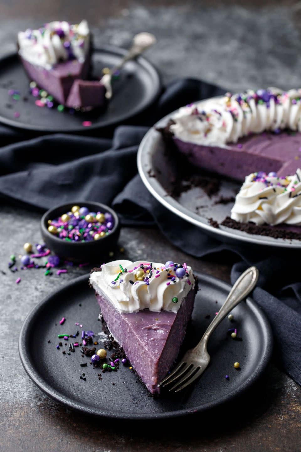 <p>You don't have to stick with the standard black and orange—a moody purple, derived from an Asian purple yam, has a similar effect. </p><p><a href="https://www.loveandoliveoil.com/2019/10/ube-coconut-cream-pie.html" rel="nofollow noopener" target="_blank" data-ylk="slk:Get the recipe." class="link ">Get the recipe.</a></p>