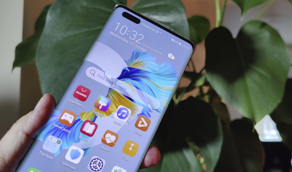 The new Huawei Mate 40 Pro smartphone is held for a photo, in London, Wednesday Oct. 21, 2020. Huawei, has unveiled its Mate 40 line of phones, Thursday Oct. 22, 2020, a product release that comes at a crucial moment for the company. (AP Photo/James Brooks)