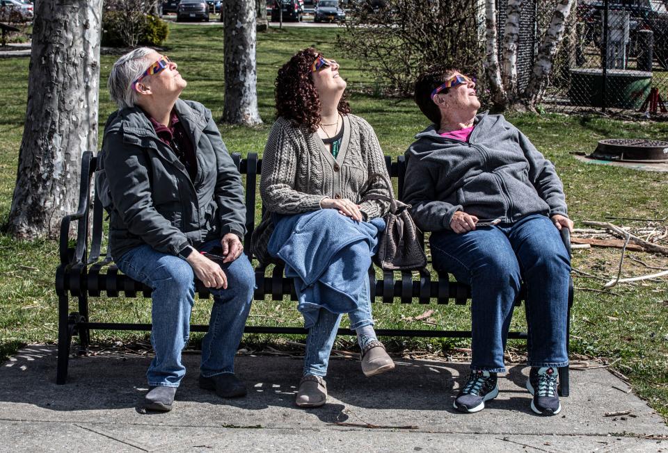 Dorren Conboy, Jessica Ferrante, and Helen Hans, all cousins, watch the eclipse at Riverfront Green Park in Peekskill. The cousins, all from out of the area, came to Peekskill to research their father’s roots from when he lived in a local orphanage as a young boy. They decided to stay for the afternoon and watch the eclipse.