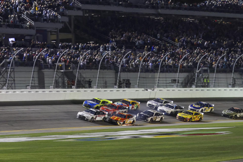 DAYTONA, FL - FEBRUARY 20: Austin Cindric (#2 Team Penske Discount Tire Ford) leads a pack of cars to the checkered flag during the Daytona 500 NASCAR Cup Series race on February 20, 2022 at Daytona International Speedway in Daytona Beach, Fl. (Photo by David Rosenblum/Icon Sportswire via Getty Images)