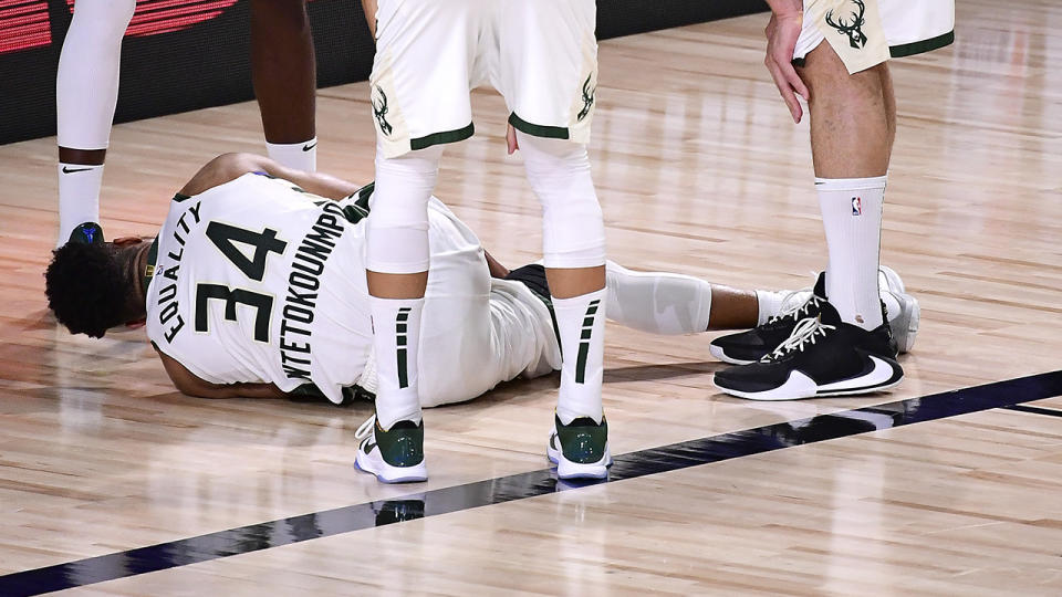 Giannis Antetokounmpoof the Milwaukee Bucks exits the game after an injury during the second quarter against the Miami Heat in Game Four of the Eastern Conference Second Round. (Photo by Douglas P. DeFelice/Getty Images)