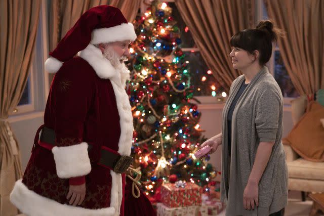 <p>Disney/James Clark</p> Tim Allen and Casey Wilson in the pilot episode of "The Santa Clauses" Disney+ series.