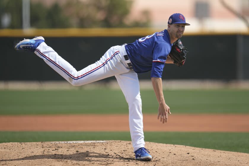 Texas Rangers starting pitcher Jacob deGrom delivers during the second inning of a AA baseball rehabilitation start with the Frisco RoughRiders against the Northwest Arkansas Naturals, Monday, March 13, 2023, in Surprise, Ariz.  (AP Photo/Abbie Parr)