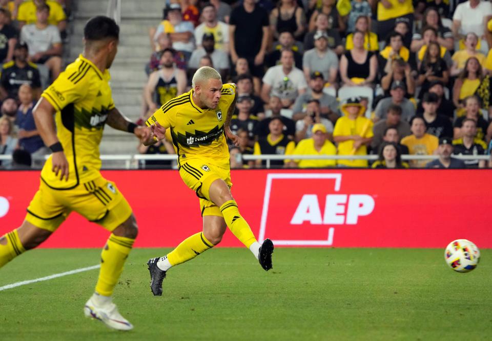 Jun 22, 2024; Columbus, OH, USA; Columbus Crew forward Christian Ramirez (17) shoots and scores against Sporting KC during the second half of their MLS game at Lower.com Field.