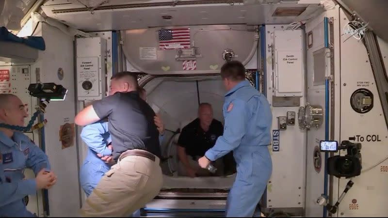 NASA astronaut Bob Behnken and Doug Hurley arrive at the International Space Station aboard SpaceX's Crew Dragon capsule in this still image taken from video