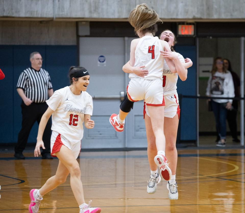 Hornell's Payton Bentley (4) celebrates with Raegan Evingham after the Red Raiders defeated Dansville 44-36.