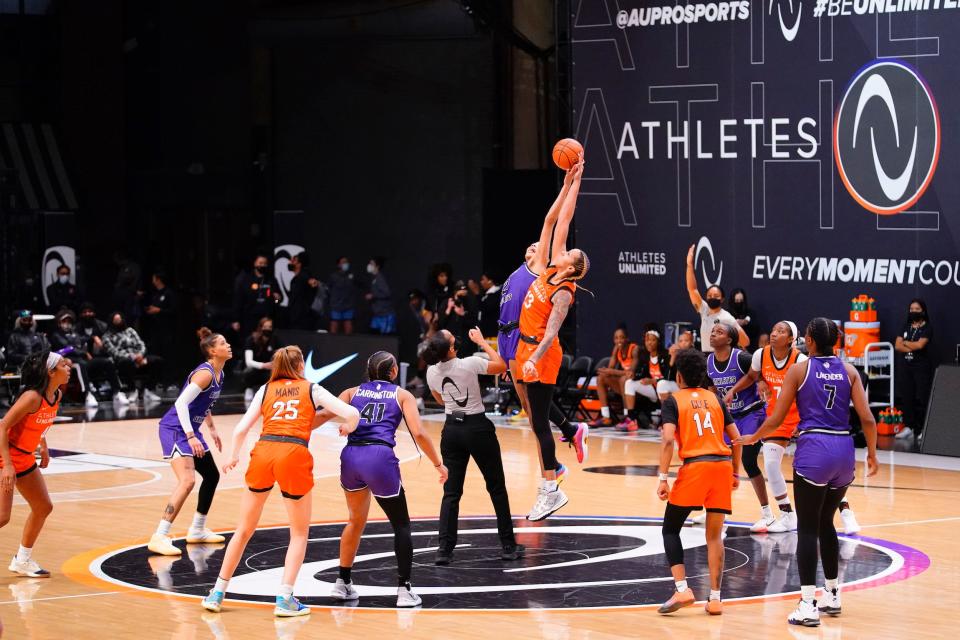 Mercedes Russell and Isabelle Harrison go up for a jump ball.