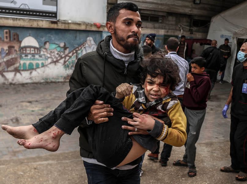 A Palestinian child is brought to Mohammed Yousef El-Najar Hospital after getting injured in Israeli attacks in Rafah, Gaza