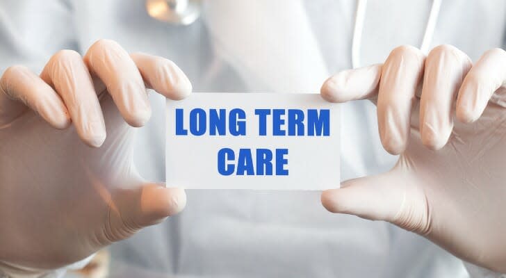 &quot;LONG TERM CARE&quot; sign being held by a doctor